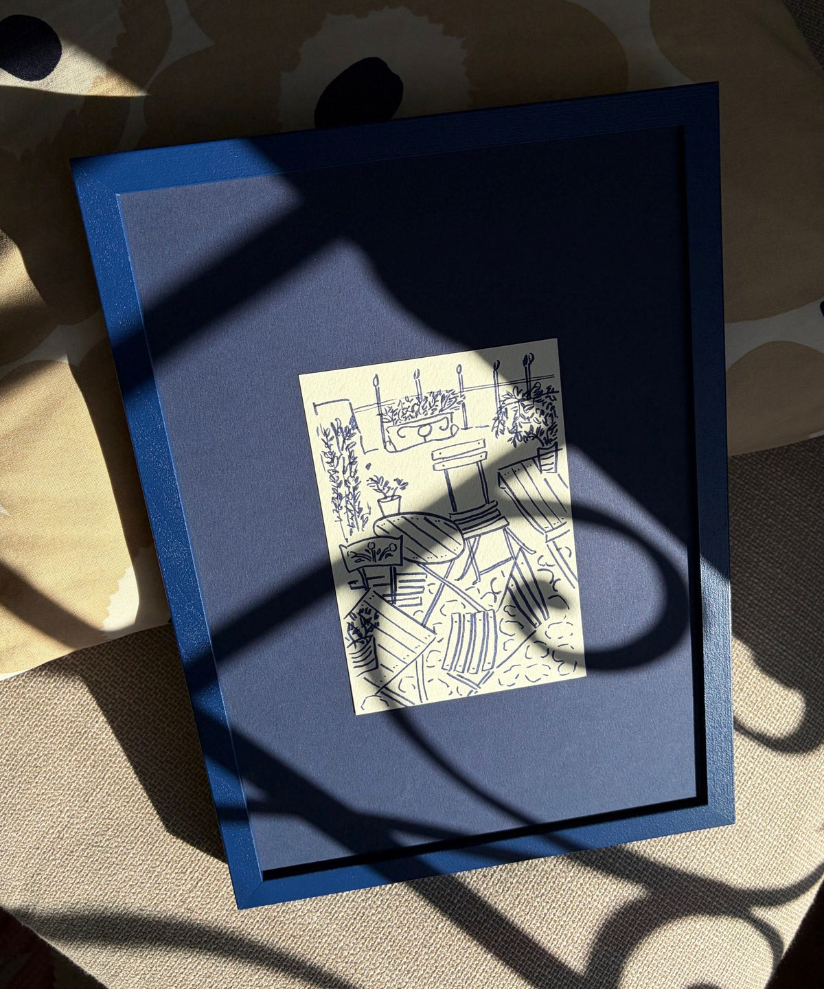 Original blue drawing on a sofa